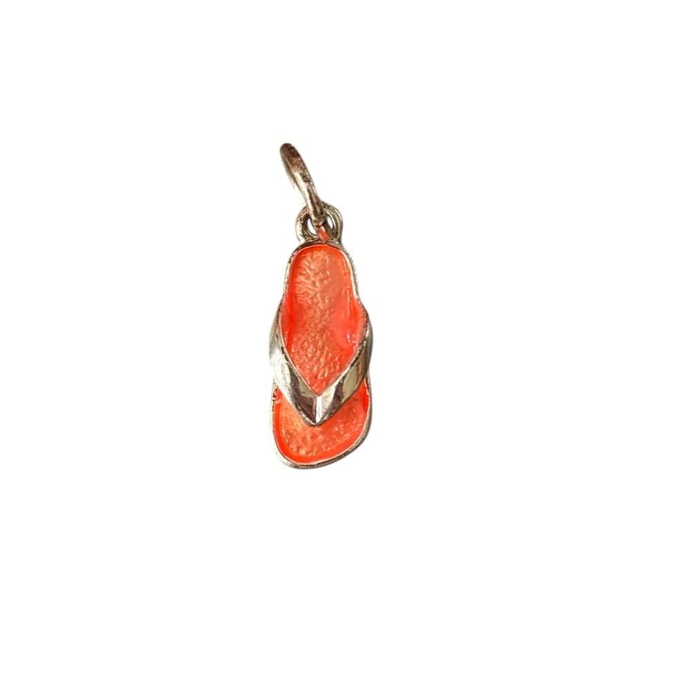 Silver toned flip flop charm with orange enamel.